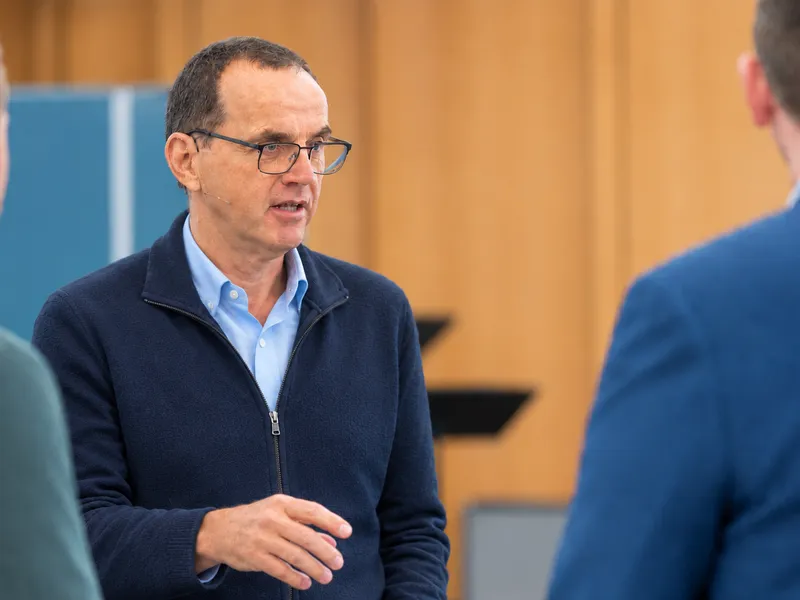 Tony Calman speaking with someone in conversation